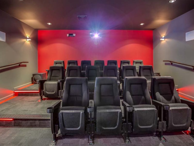 This image shows the premium community amenities, particularly the media center featuring its theater seats that were admirable for a movie treat.
