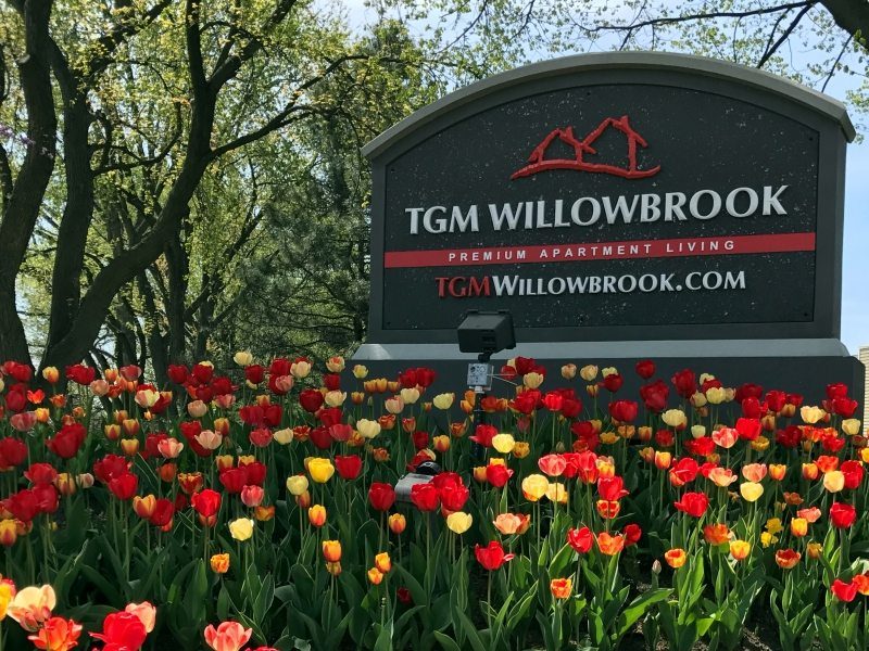 This image shows the elegant TGM Willowbrook Apartments monument in Willowbrook, IL.