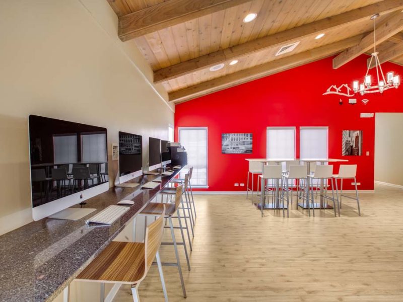 This image shows the premium community amenities, particularly the high-technology apple computer bar featuring direct access through the café lounge.